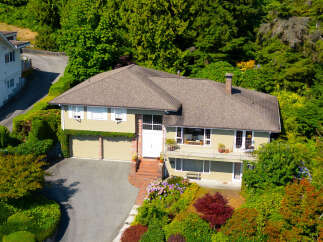 Discover this charming home nestled amidst lush greenery, offering a serene retreat.