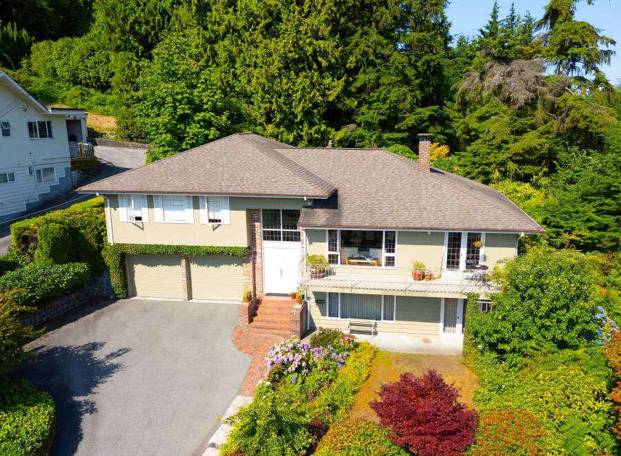 Discover this charming home nestled amidst lush greenery and mature trees, offering a serene retreat.