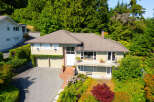 Discover this charming home nestled amidst lush greenery and mature trees, offering a serene retreat.