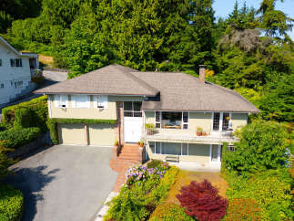 Discover this charming home nestled amidst lush greenery and mature trees, offering a serene retreat.