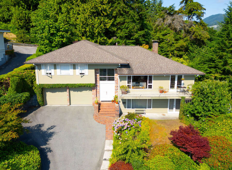 Discover this charming home nestled amidst lush greenery, offering a serene retreat.