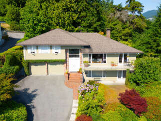 Discover this charming home nestled amidst lush greenery, offering a serene retreat.