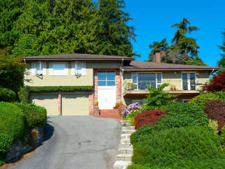 Discover this charming home featuring a welcoming facade with a spacious driveway leading to a double garage.