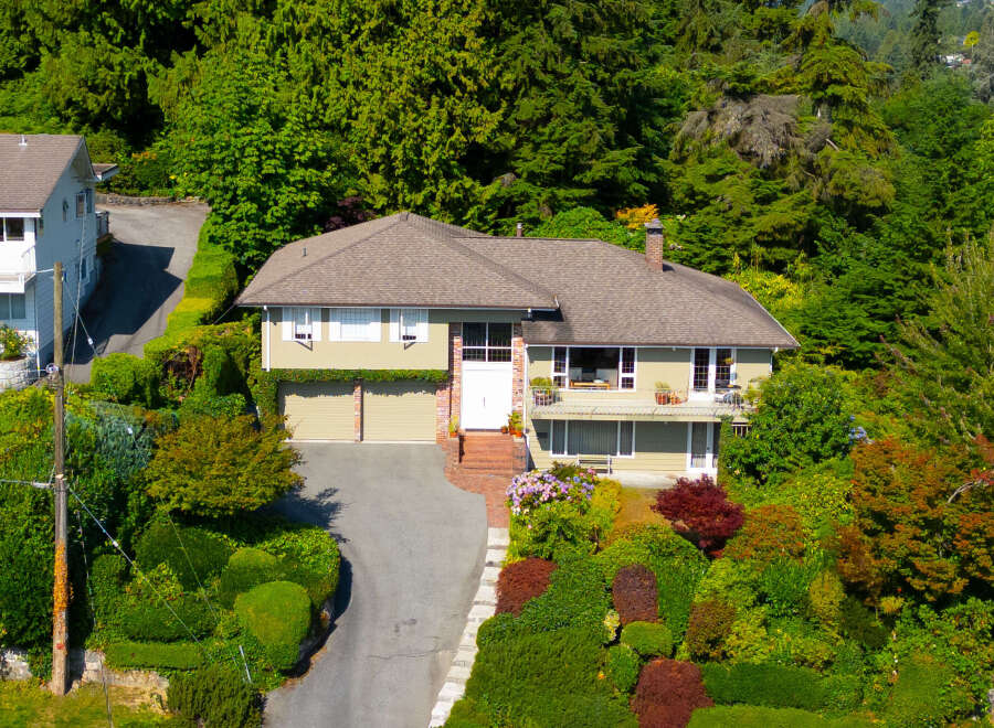 Discover this charming home nestled amidst lush greenery, offering a serene retreat.