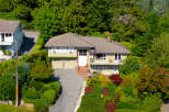Discover this charming home nestled amidst lush greenery, offering a serene retreat.