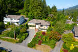 Discover this charming home nestled amidst lush greenery and mature trees, offering a serene and private retreat.