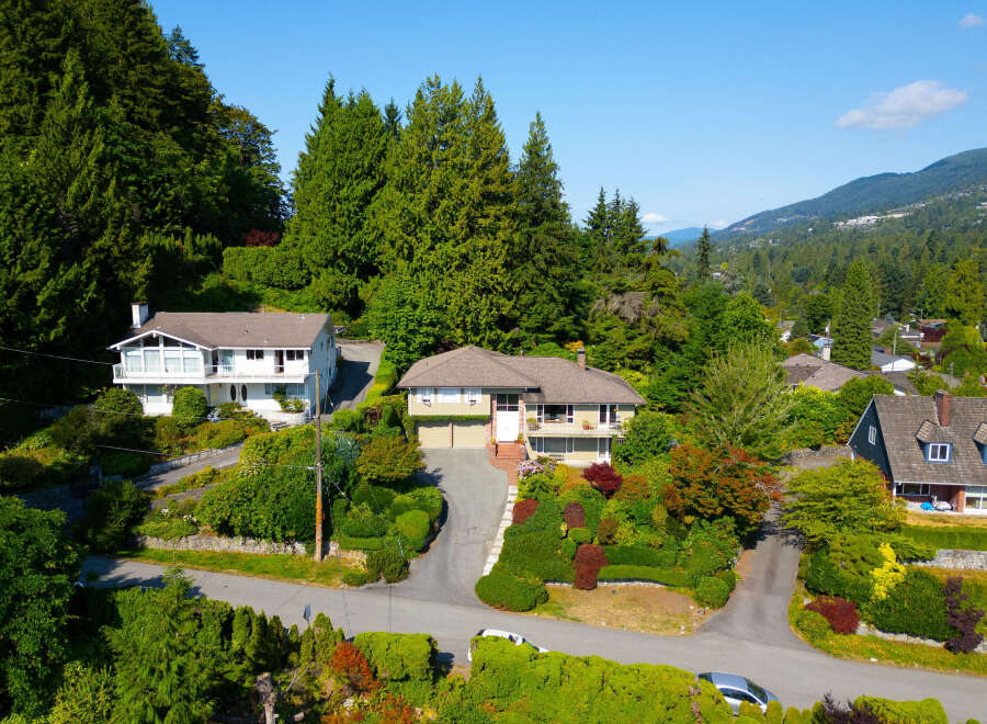 Nestled amidst lush greenery and mature trees, this stunning property offers a serene retreat with breathtaking mountain views.