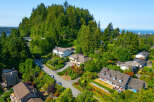 Discover this stunning hillside residence offering breathtaking panoramic views of the ocean and distant city skyline.
