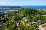 Discover this stunning residential area with beautiful homes nestled amongst lush greenery and mature trees.
