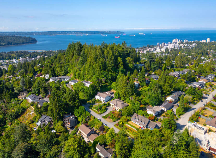 Discover this stunning property nestled amidst lush greenery, offering breathtaking views of the ocean and city skyline.