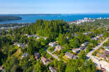 Discover this stunning property nestled amidst lush greenery, offering breathtaking views of the ocean and city skyline.