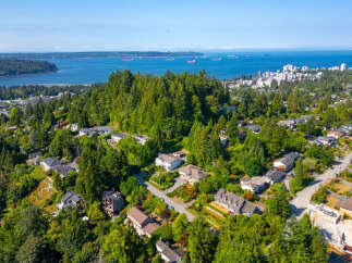 Discover this stunning property nestled amidst lush greenery, offering breathtaking views of the ocean and city skyline.