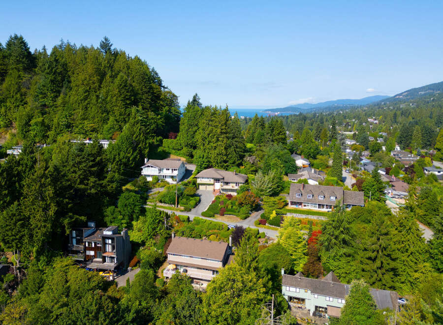 Discover this stunning multi-level home nestled amidst lush greenery and mature trees, offering a serene and private retreat.