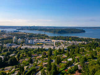 Experience breathtaking panoramic views of the Vancouver skyline and the Lions Gate Bridge from this stunning property.