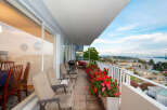 Enjoy breathtaking views from this spacious balcony, perfect for outdoor dining and relaxation.