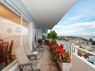 Enjoy breathtaking views from this spacious balcony, perfect for outdoor dining and relaxation.