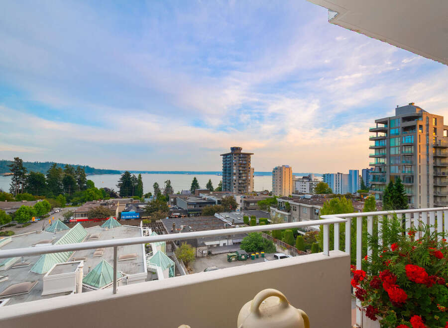 Enjoy breathtaking views from this stunning property, featuring a spacious balcony overlooking the water and city skyline.