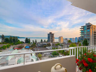 Enjoy breathtaking views from this stunning property, featuring a spacious balcony overlooking the water and city skyline.