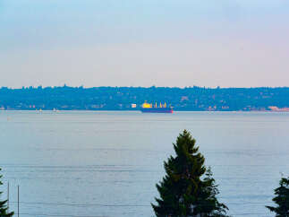 Experience breathtaking waterfront living with this stunning property offering panoramic views of the serene bay.