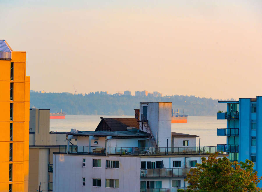 Experience stunning waterfront living with panoramic views of the ocean and distant city skyline.