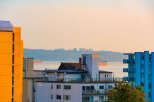 Experience stunning waterfront living with panoramic views of the ocean and distant city skyline.