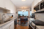Enjoy breathtaking water views from this charming kitchen and dining area, perfect for entertaining.