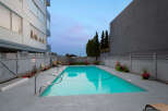 Enjoy a refreshing dip in this stunning outdoor swimming pool, perfect for relaxation and recreation.