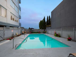 Enjoy a refreshing dip in this stunning outdoor swimming pool, perfect for relaxation and recreation.