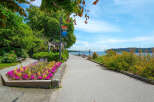 Enjoy scenic waterfront living with this stunning property featuring a paved walkway perfect for leisurely strolls along the water.