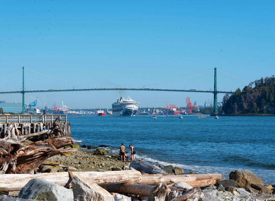 Experience waterfront living with stunning views of the Lions Gate Bridge and a bustling harbor.