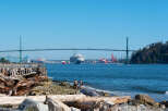 Experience waterfront living with stunning views of the Lions Gate Bridge and a bustling harbor.