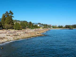 Experience coastal living at its finest with this stunning property offering direct access to a picturesque beach.