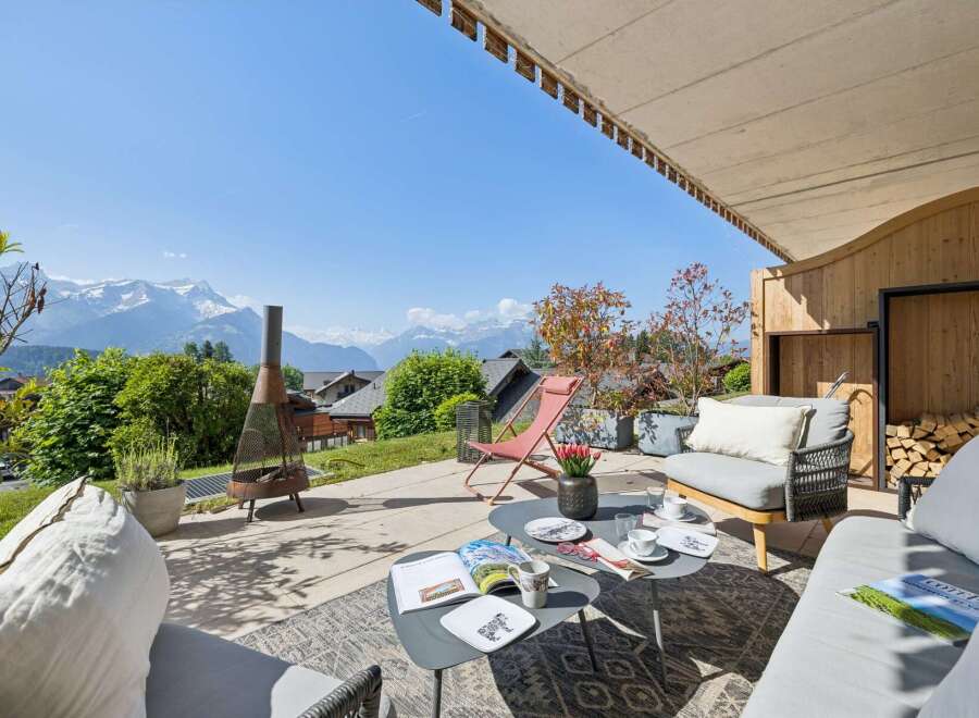 Experience breathtaking mountain views from this stunning outdoor living space, perfect for relaxation and entertaining.