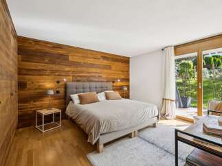 Experience rustic charm and modern comfort in this beautifully appointed bedroom.