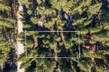 Discover this picturesque wooded lot, perfect for building your dream home amidst towering trees.
