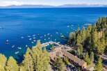 Experience the ultimate lakeside living with this stunning property offering direct access to a vibrant marina and crystal-clear waters.