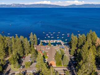 Experience the ultimate lakeside lifestyle with this stunning property offering direct access to a private marina and breathtaking views of Lake Tahoe.