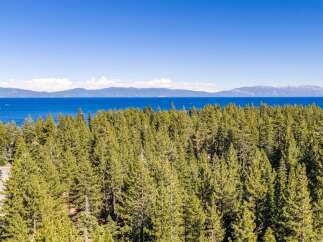 Experience breathtaking lake views and lush forest scenery from this prime location.