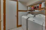 This laundry room features a convenient side-by-side washer and dryer set, perfect for handling large loads.