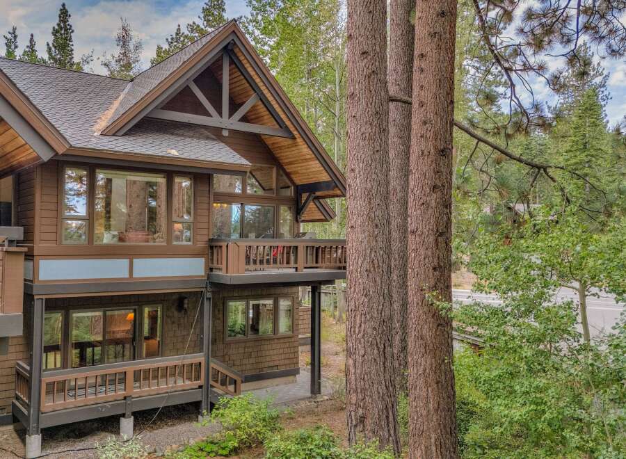 Nestled amongst towering trees, this stunning mountain home offers a perfect blend of rustic charm and modern luxury.