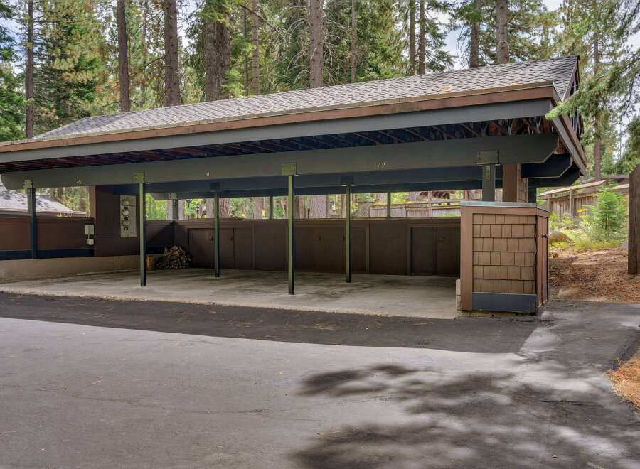 Discover this spacious carport, perfect for protecting your vehicles from the elements.