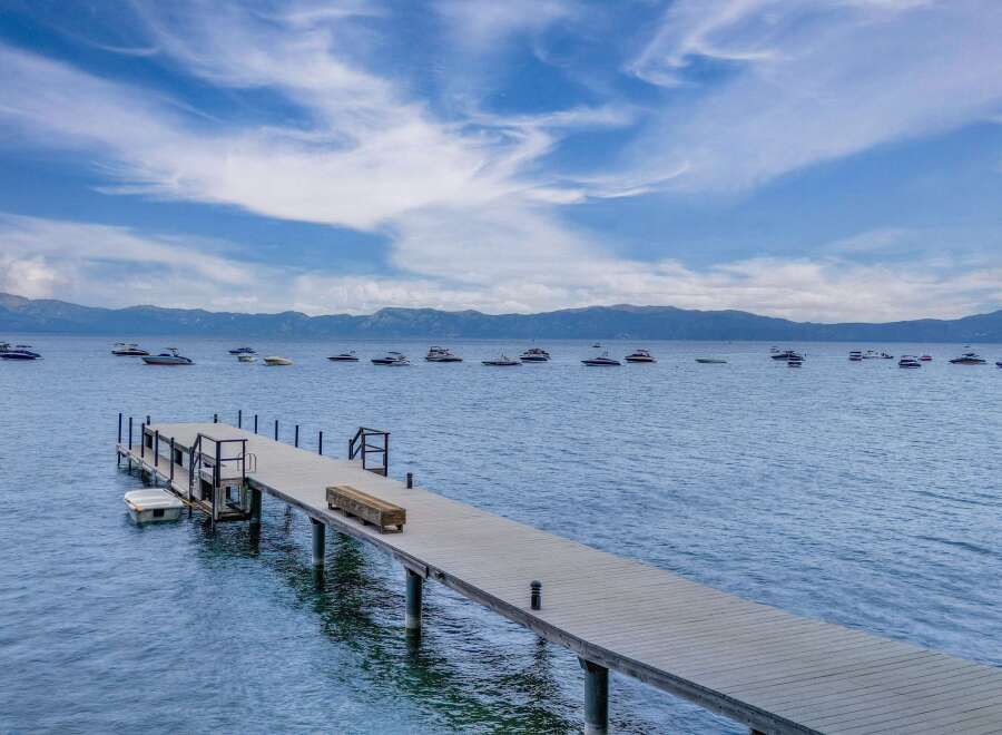 Enjoy breathtaking lake views from this stunning property featuring a private dock perfect for your watercraft.