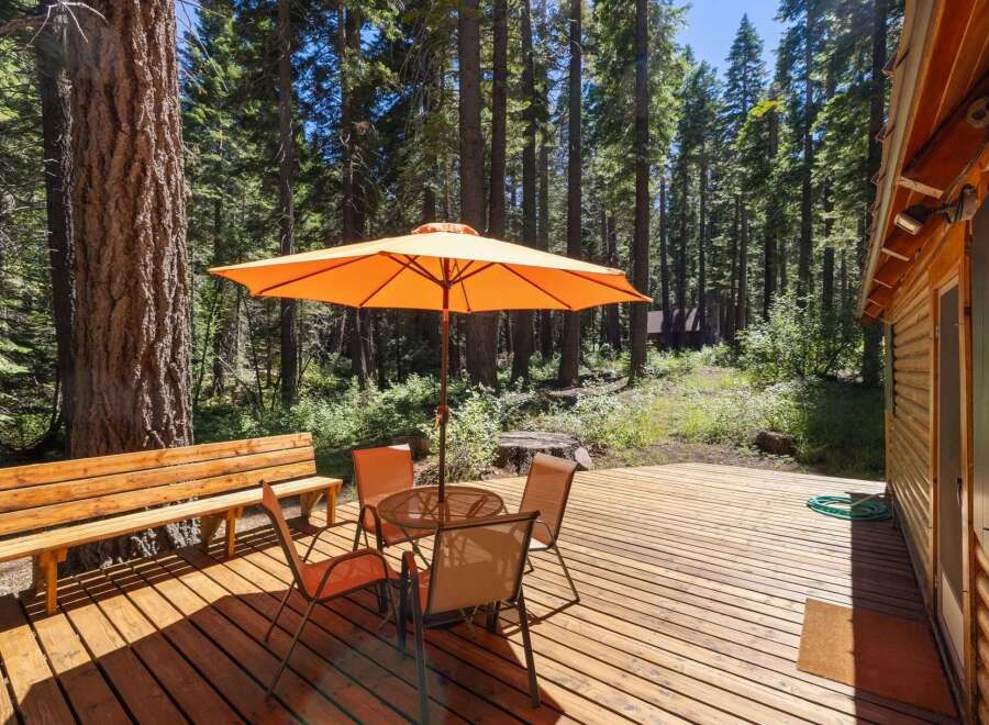 Enjoy outdoor living on this spacious wooden deck, perfect for relaxing or entertaining.
