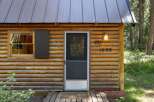 Experience rustic charm in this cozy log cabin, perfect for a secluded getaway.