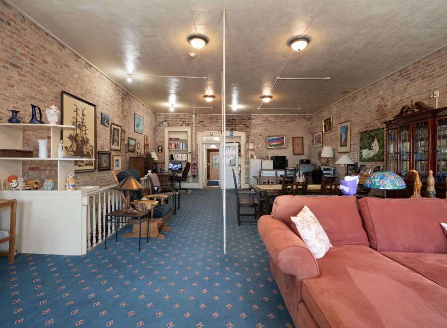 Discover this charming space featuring exposed brick walls and a unique, eclectic decor.