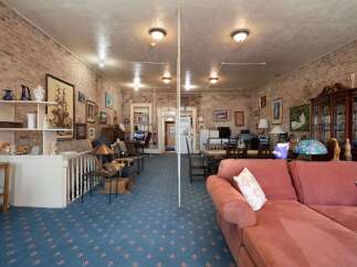 Discover this charming space featuring exposed brick walls and a unique, eclectic decor.
