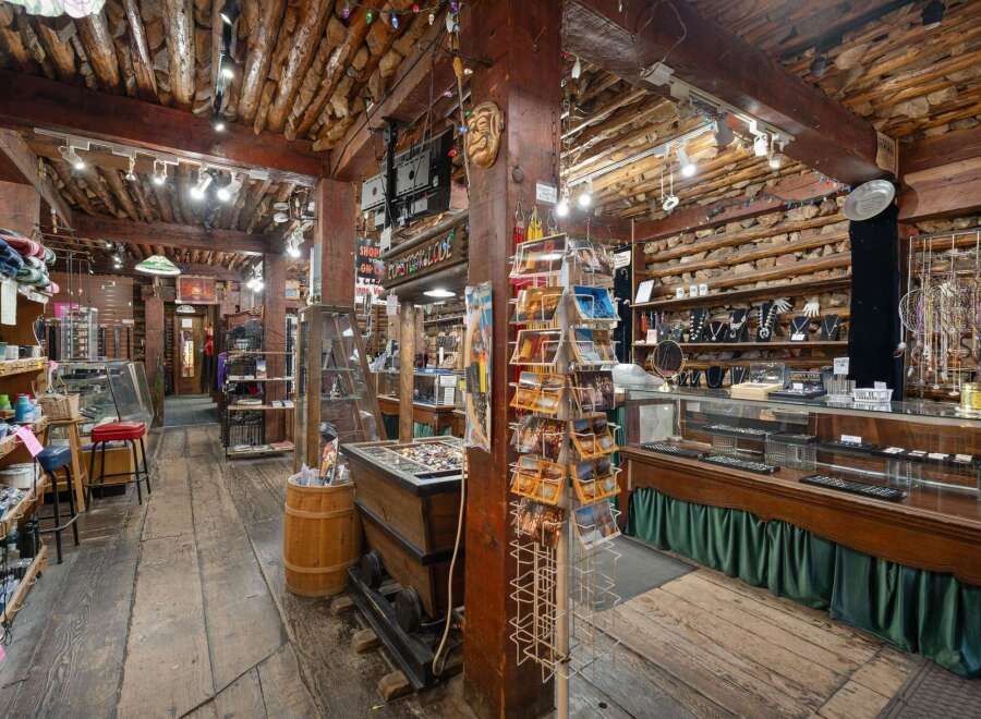 Discover unique treasures in this charming rustic shop, featuring a wide array of jewelry, souvenirs, and local crafts.