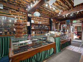 Discover unique handcrafted jewelry and Native American crafts in this charming rustic store.