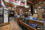 Discover unique motorcycle apparel and accessories in this rustic, log-cabin-style shop, featuring a wide selection of jackets, chaps, vests, and halters on clearance.