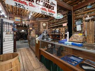 Discover unique motorcycle apparel and accessories in this rustic, log-cabin-style shop, featuring a wide selection of jackets, chaps, vests, and halters on clearance.